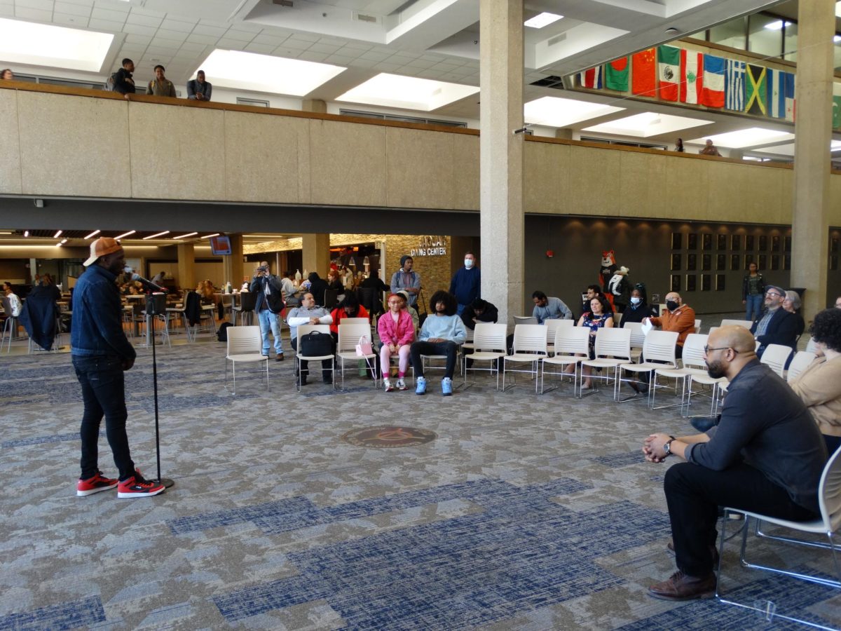 Orville Brown telling his story to the First Voice Story Slam crowd in the Hall of Governors