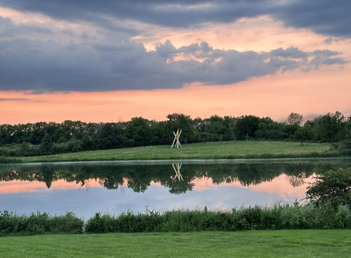 Stargazing with Contrails by Terrence Karpowicz across the lake at Governors State University