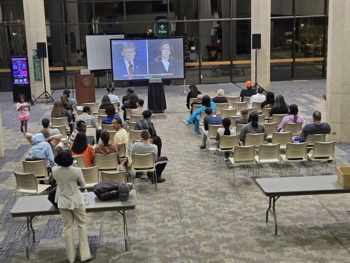 (Students watching the 2024 presidential debate.)