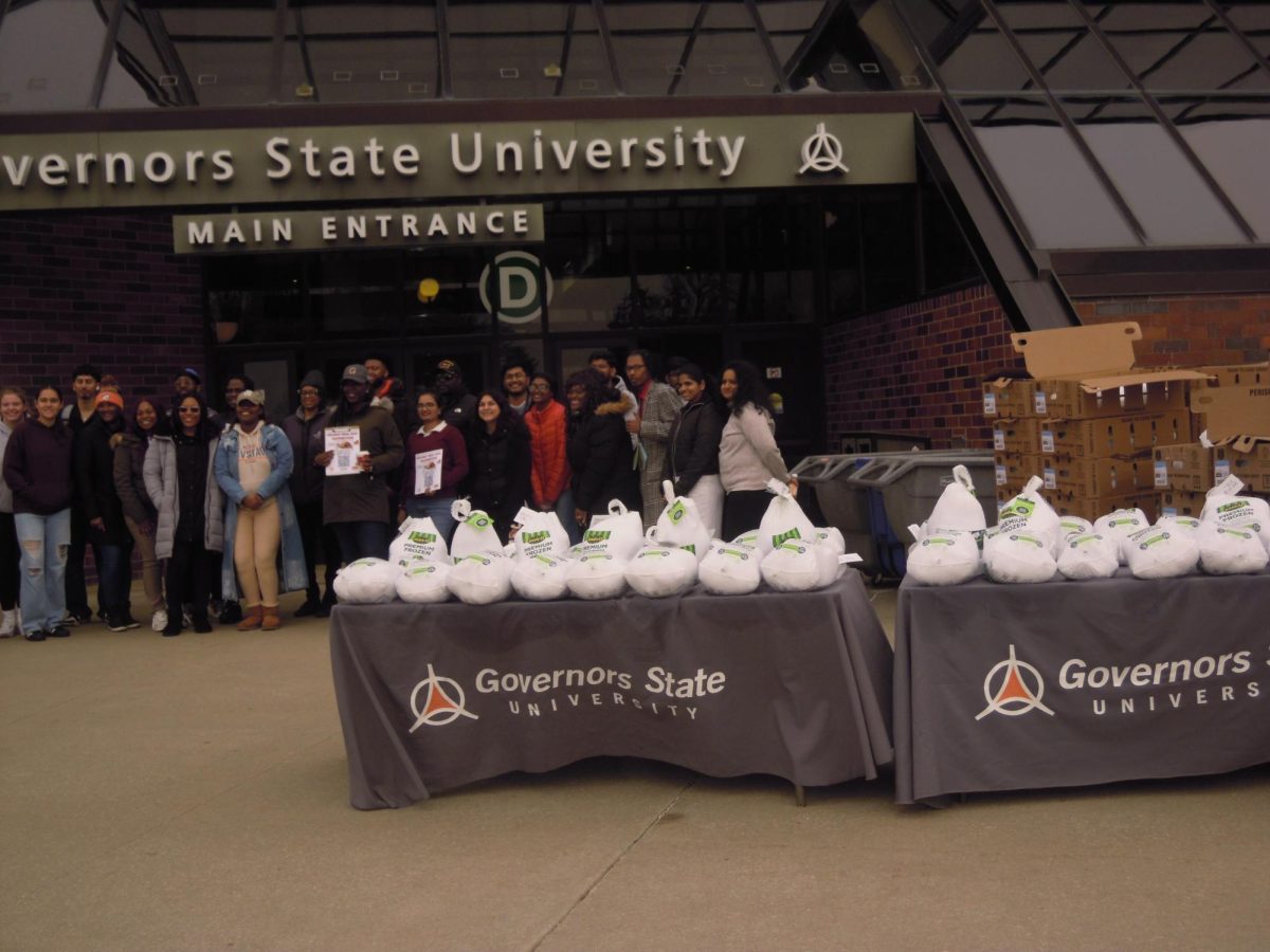 Students, staff and faculty members gather for the Annual Thanksgiving Meal box Distribution