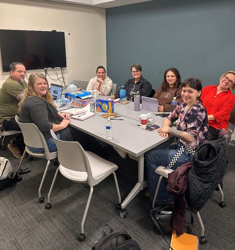 Students and advisers at a Psi Chi meeting.