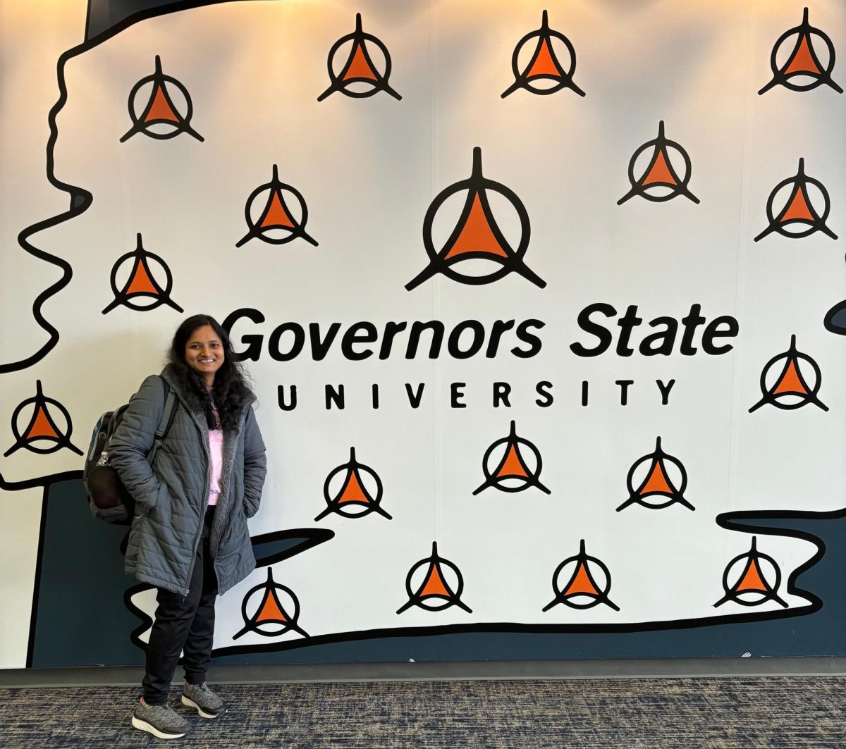 The author in front of a GovState welcoming sign.