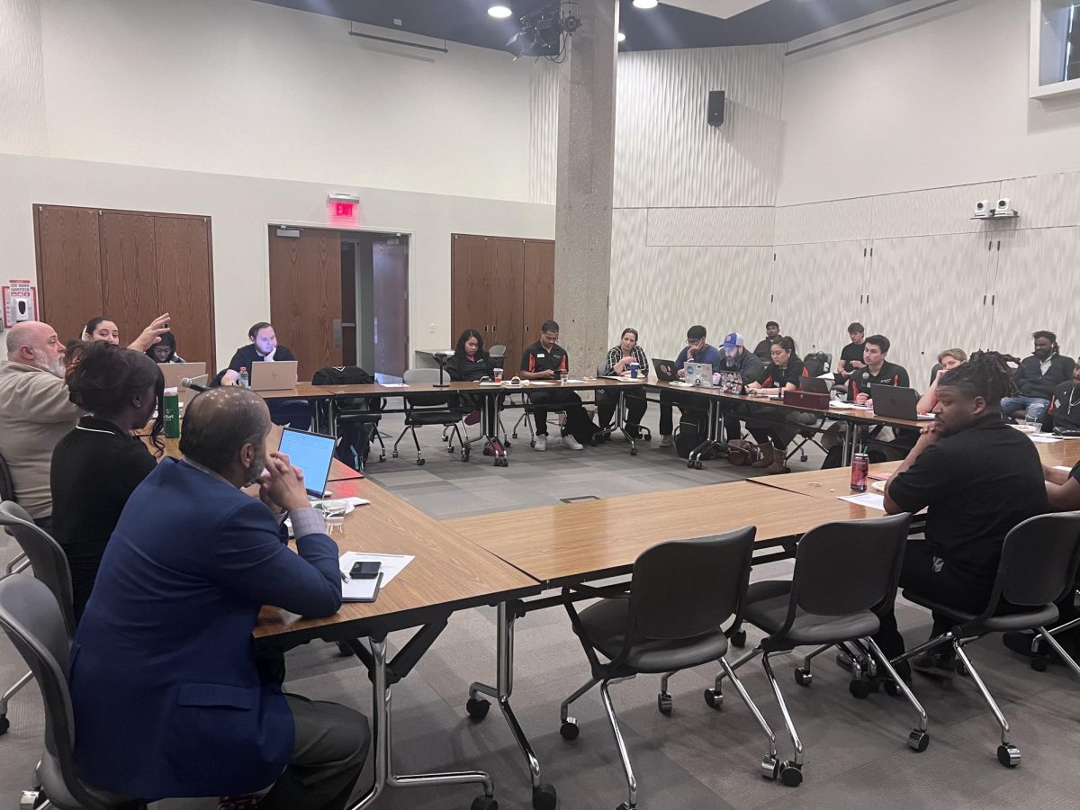 Student leaders and university representatives gather during the Governors State University Student Senate meeting in Engbretson Hall, where Vice President Dr. David Hermann attended to hear student concerns and engage with campus leadership.  