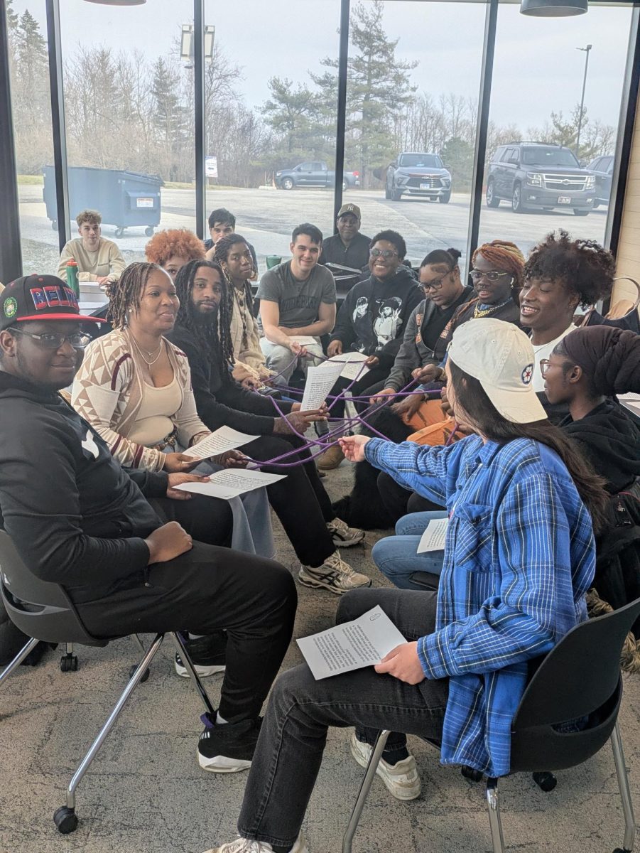 Students reading the texts assigned by Ms. Monica Cosby at the event in Social Justice Building