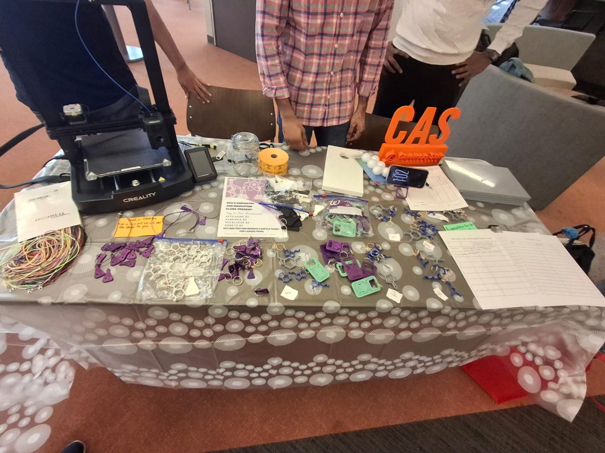 3D-printed keychains, earrings, and phone holders on display at the “Keys to Fun” fundraiser.