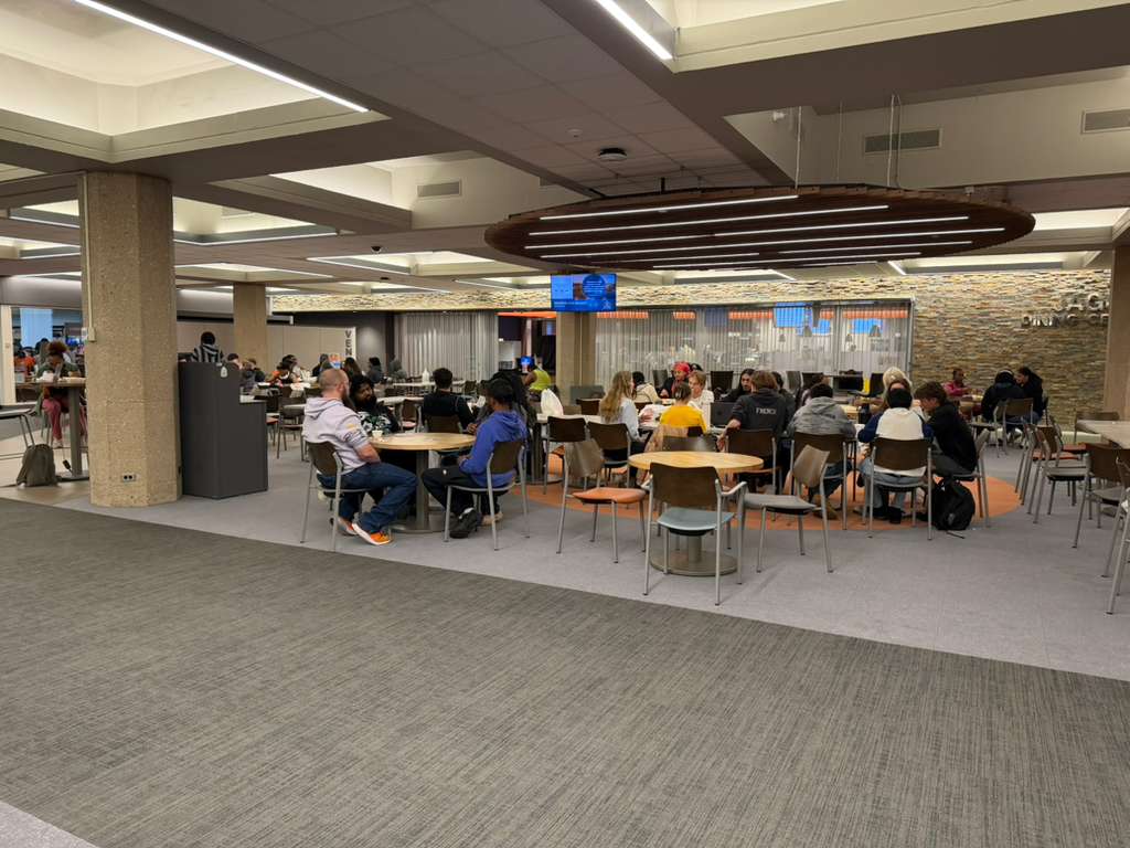 Students enjoying food at Late Night Breakfast event
